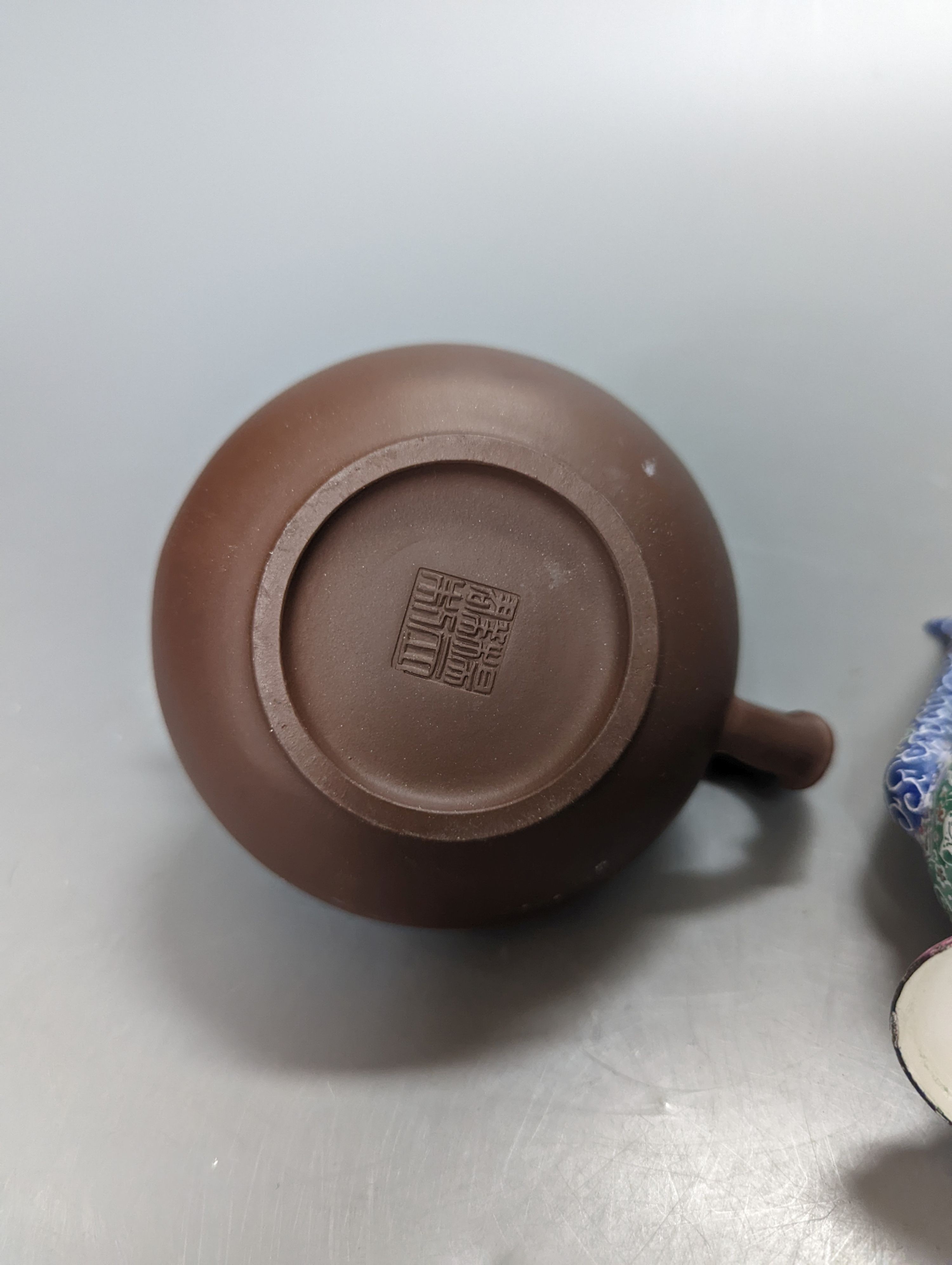 A Chinese Yixing teapot and a Isfahan enamel on copper ewer, 16.5cm high